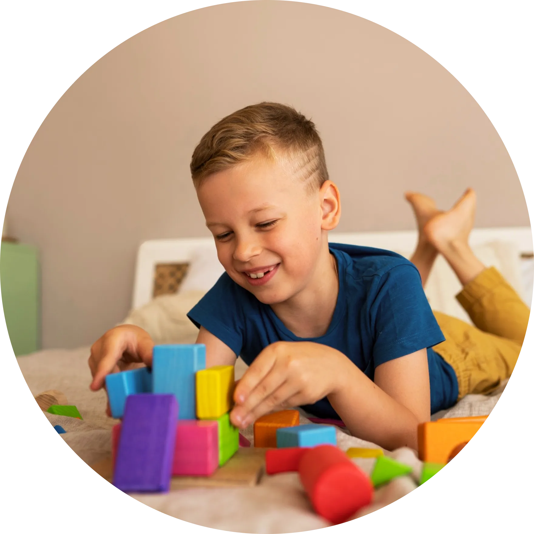 child playing with toys have a smile on his face